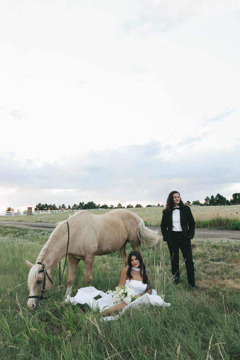 romantic and documentary engagement photos  of a couple kissing in a field