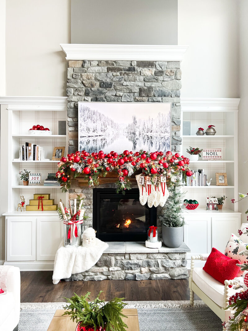 a fireplace mantle decorated for Christmas