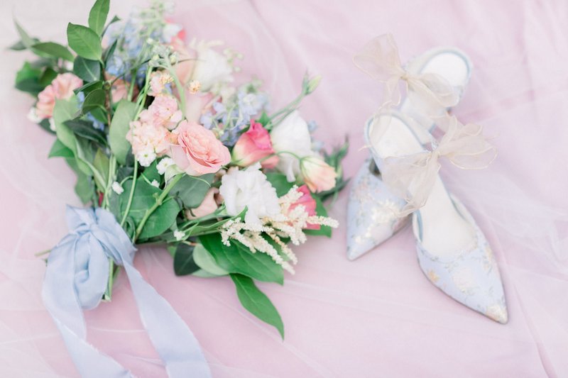 Bride's wedding day shoes and bouquet