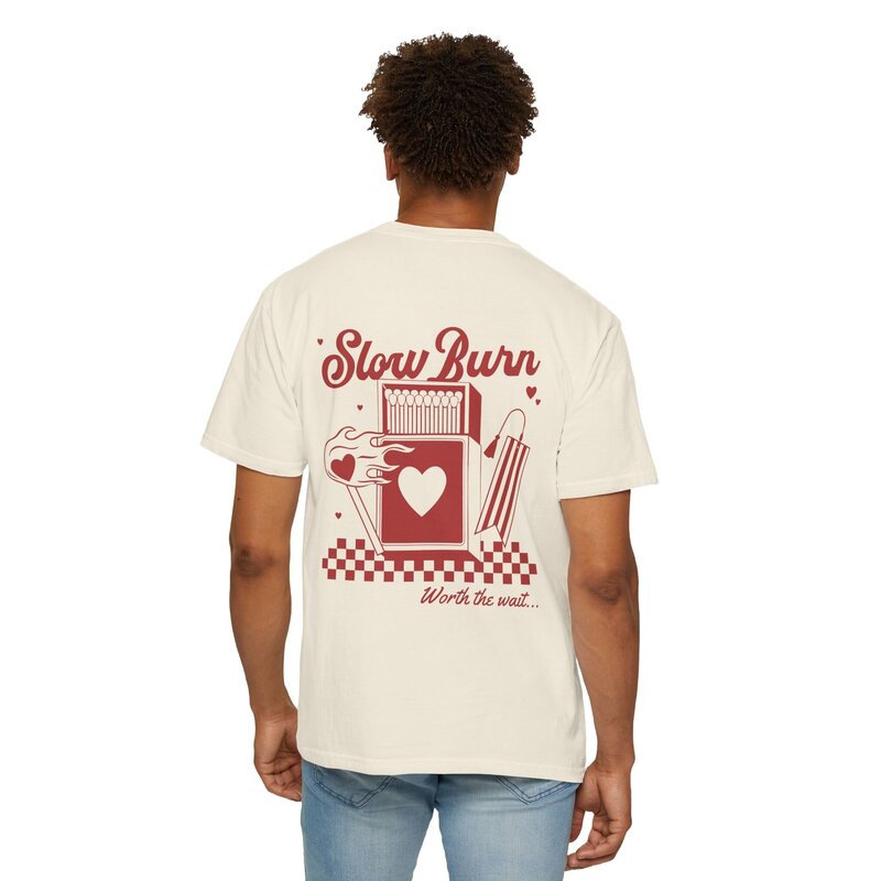 A man wearing cream and red graphic t-shirt that says slow burn.