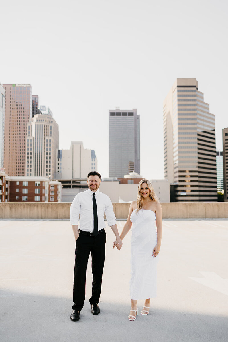 bride and groom smiling outside