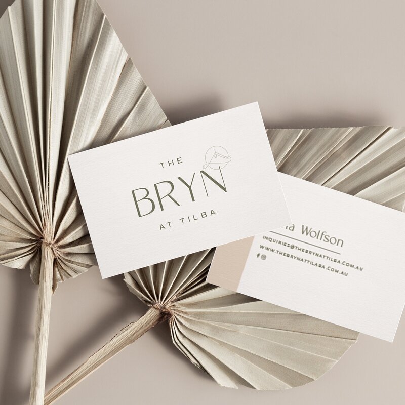 Business card for The Bryn at Tilba on two decorative fans