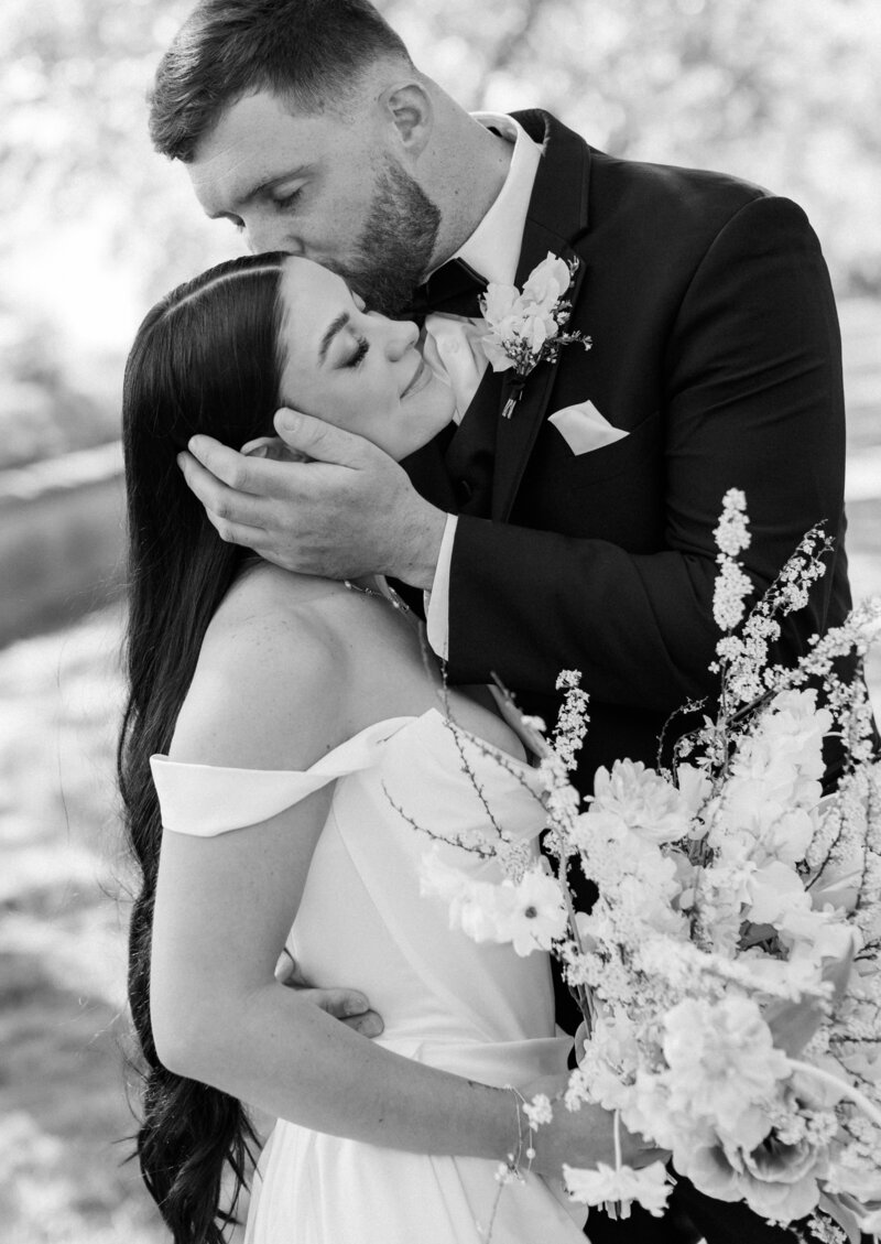 A bride and groom kissing on their wedding day in Southern California.