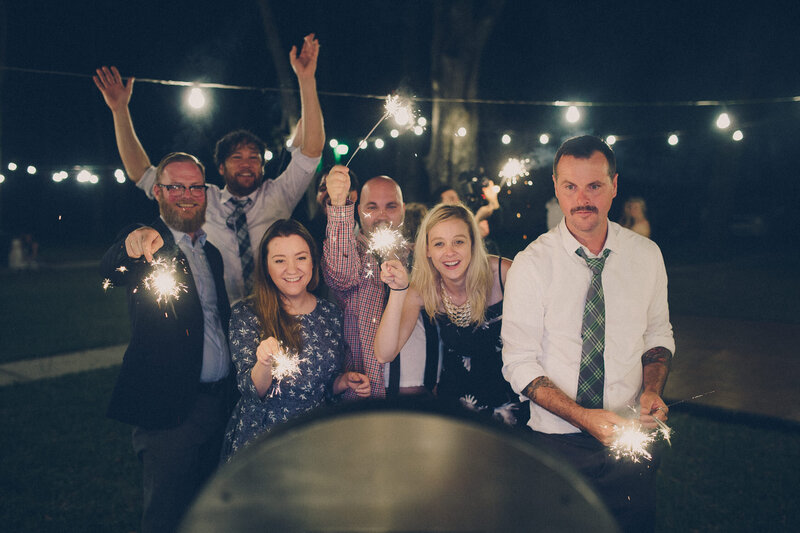 Luxury Portraits by Moving Mountains Photography in NC - Photo of wedding guests celebrating with sparklers.