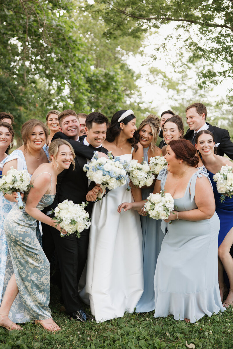 Photo of wedding party celebrating together in Forest Park wedding