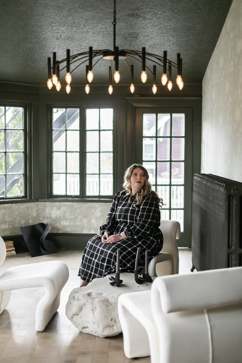 Life coach and author Ashleigh Henry in a black and white dress — visually expressing what it means to live a deeply inhabited, harmonious life.