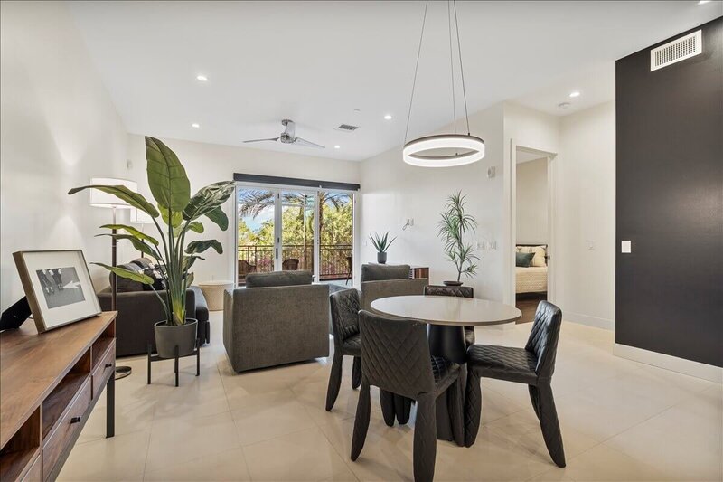 Modern Scottsdale condo interior with open living and dining area, staged for a real estate listing to sell with a REALTOR®