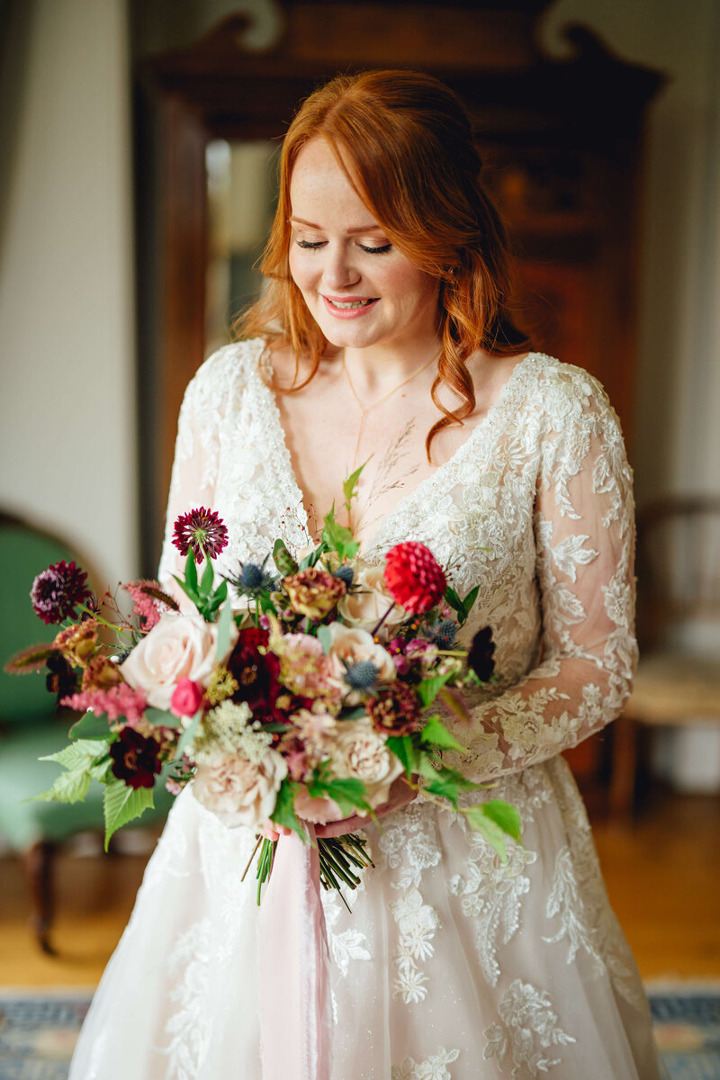 Bride looking at her flowers at Homme House