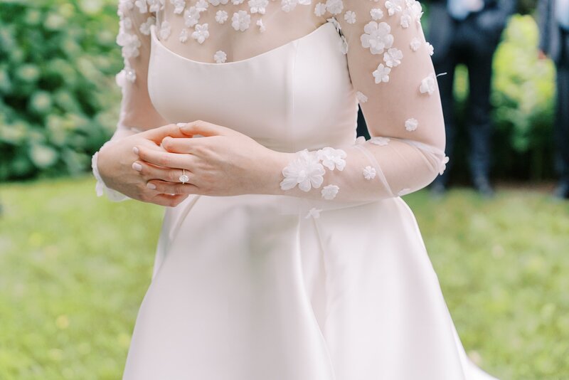 Bride with bridesmaids holding umbrellas