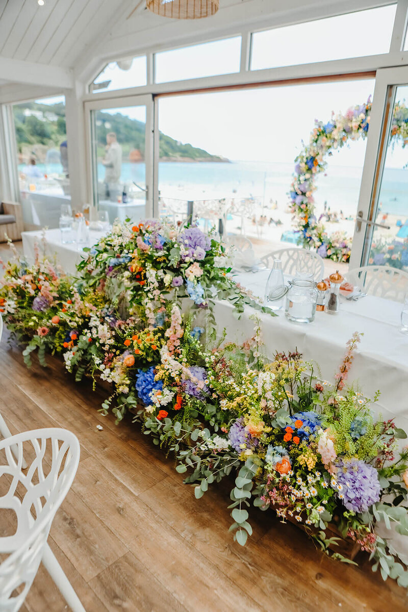 Bride and groom stood in the marquee at Carbis Bay