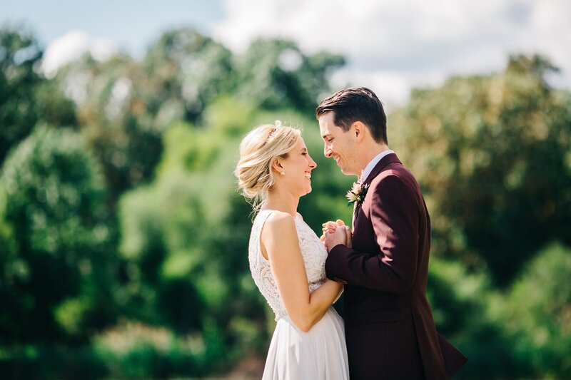 Bride and groom embracing outdoors during golden hour, captured by Philadelphia photographer Alexa Nahas.
