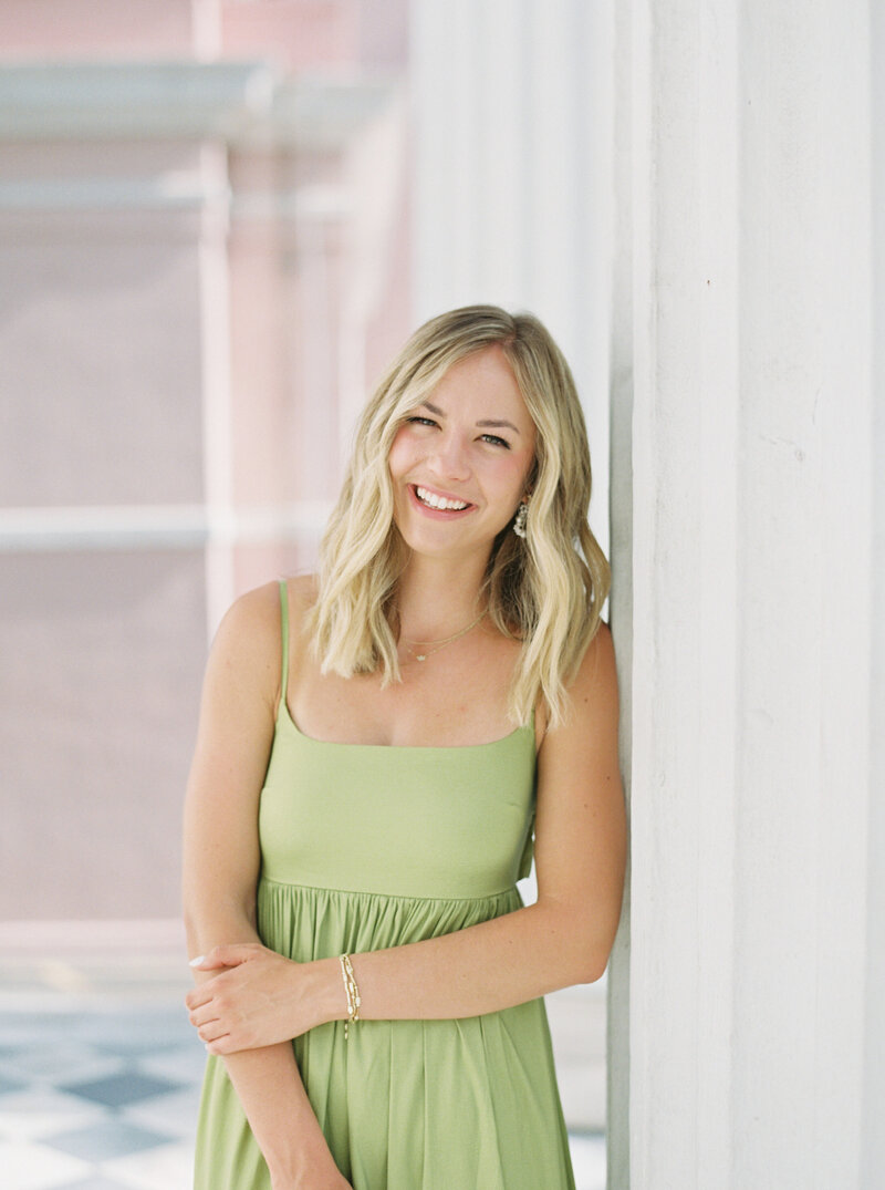 headshot of jacqueline smiling in a blue dress