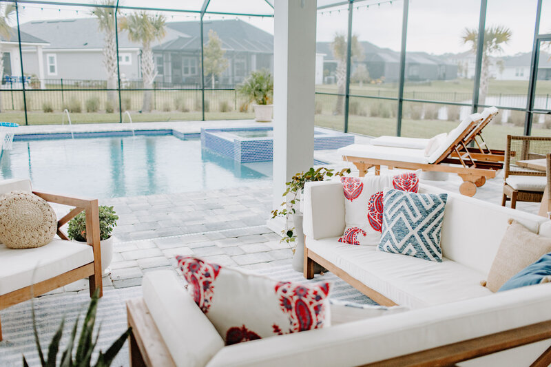 Outdoor space featuring cozy seating, layered textures, and stylish functionality designed for relaxing and entertaining.