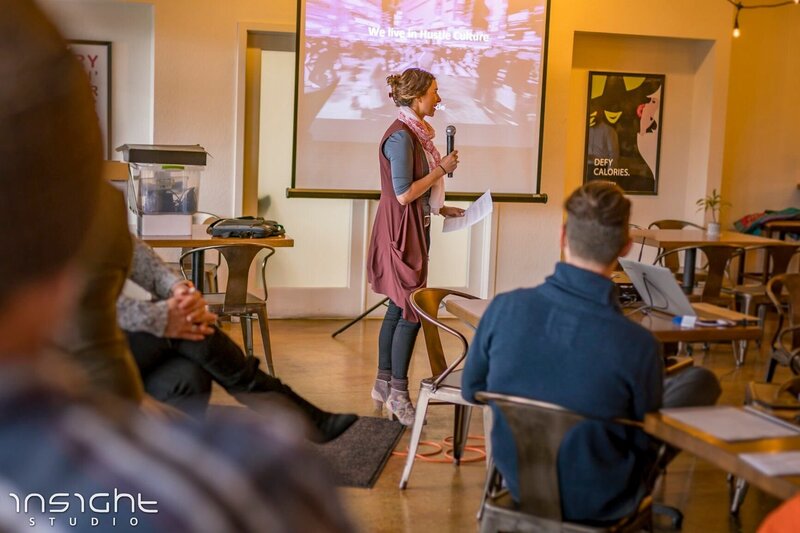 Milena speaking at an event