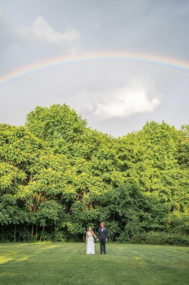 Black bride and groom taking portraits