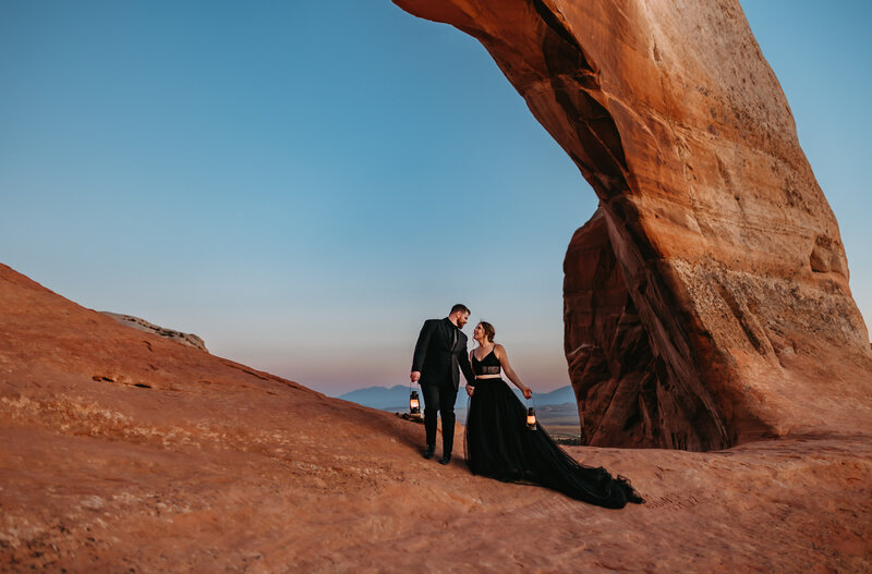 Couple exploring the dramatic landscapes of the desert, photographed by an Oregon Coast Elopement and Wedding Photographer.