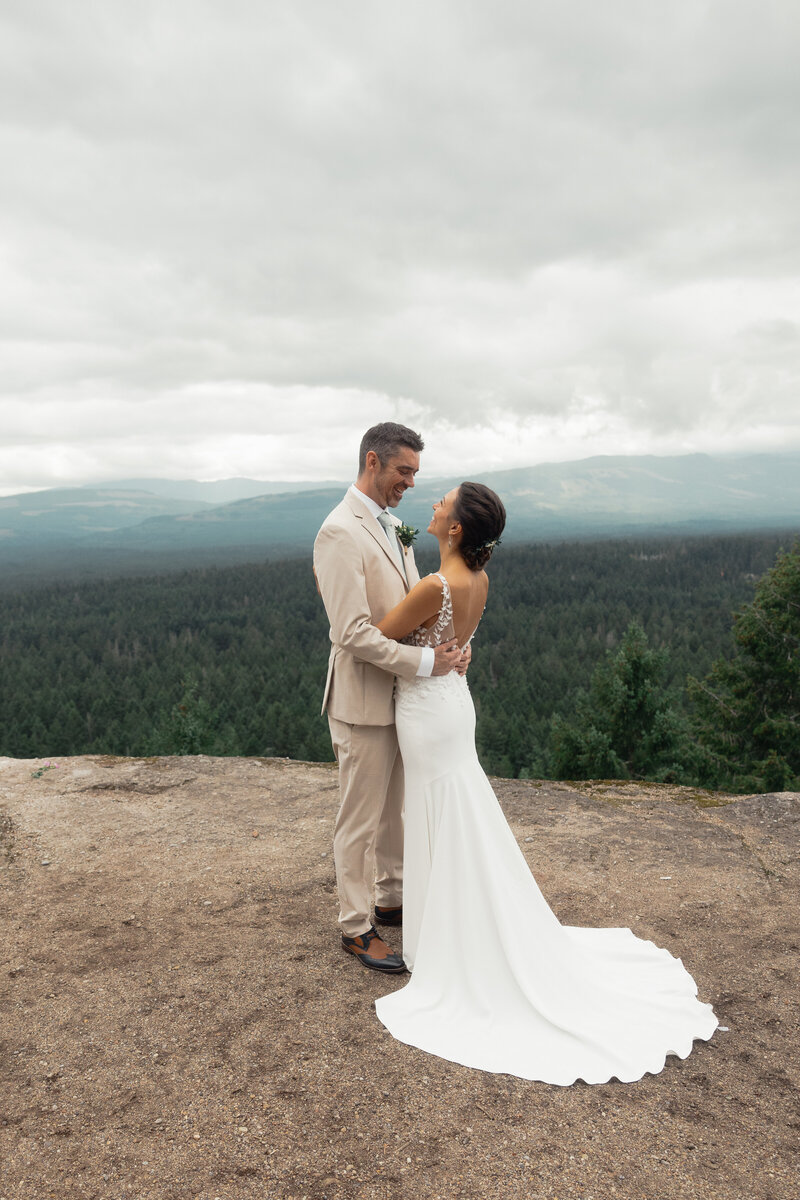 Joyful couple sharing a laugh during their Vancouver Island elopement ceremony, photographed by Rae Terrillon