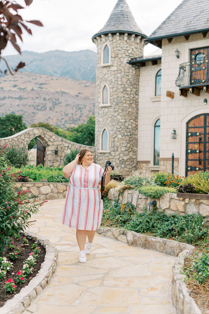 Shalae stands in striped pink dress at Wadley Farms in Utah