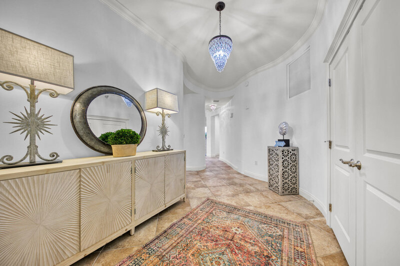 hallway entrance with oriental rug credenza with lamps