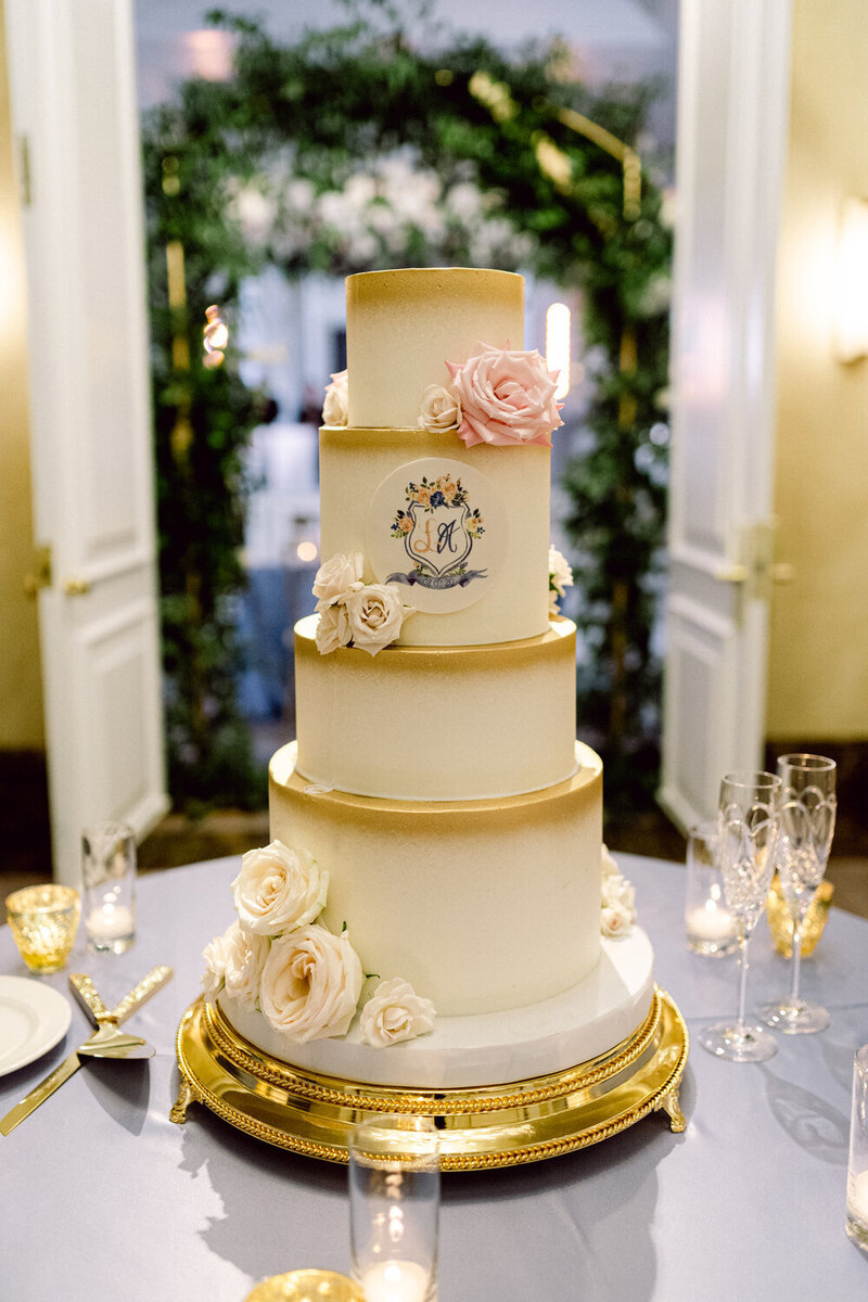 Swank Soiree Dallas Wedding Planner Lauren and Ashton at the Crescent Hotel - white and gold wedding cake with white roses