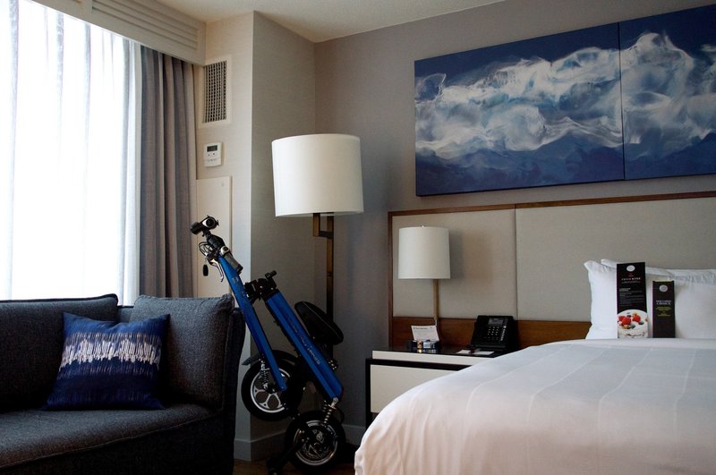 Blue Go-Bike M2 folded up in hotel room