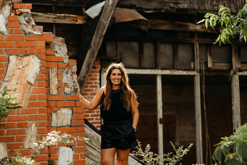 Sierra Emerson by brick wall