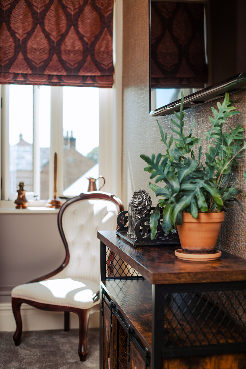 The White Lion Hankelow Bedroom including dressing chair, side table and plant - Home -Stay