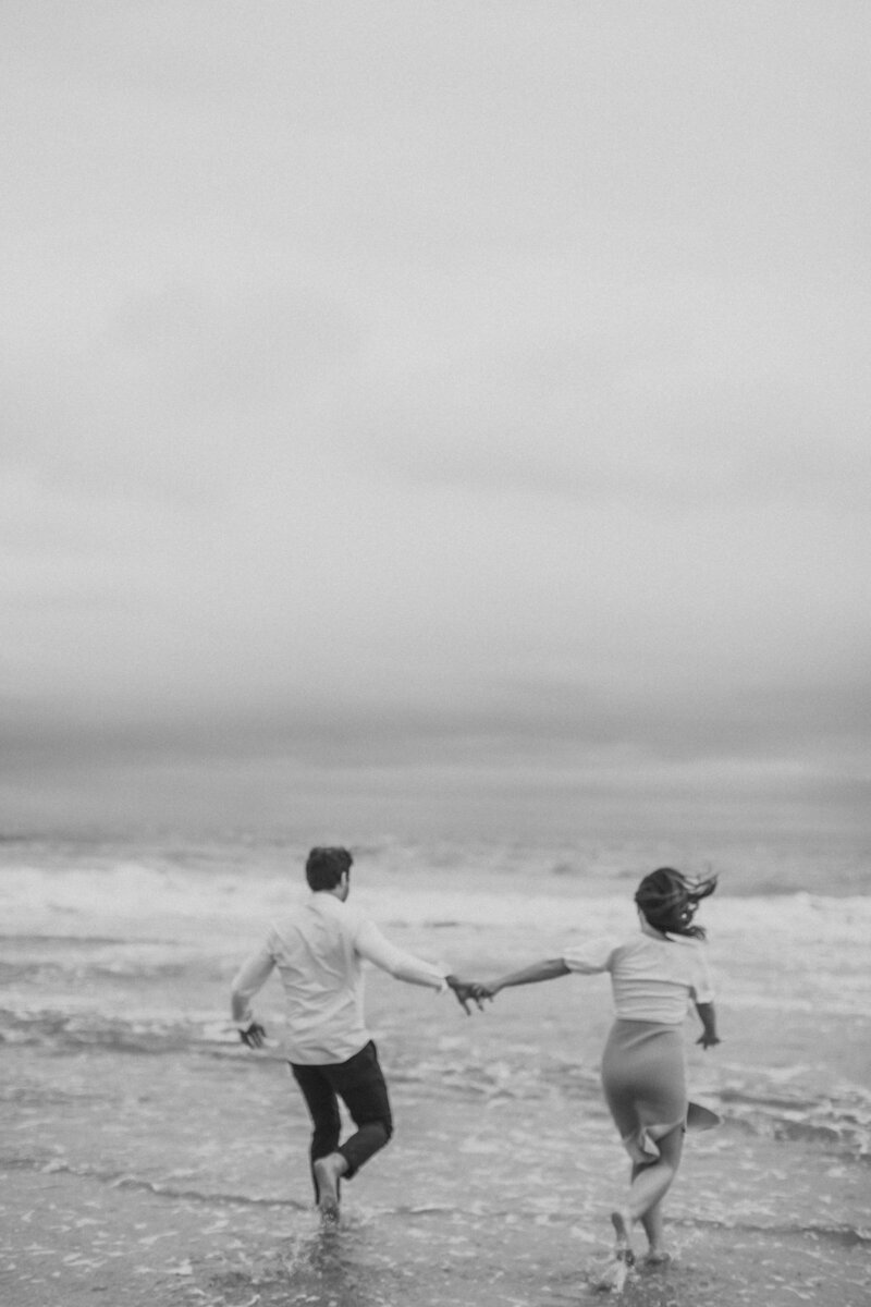 Couple runs into the ocean