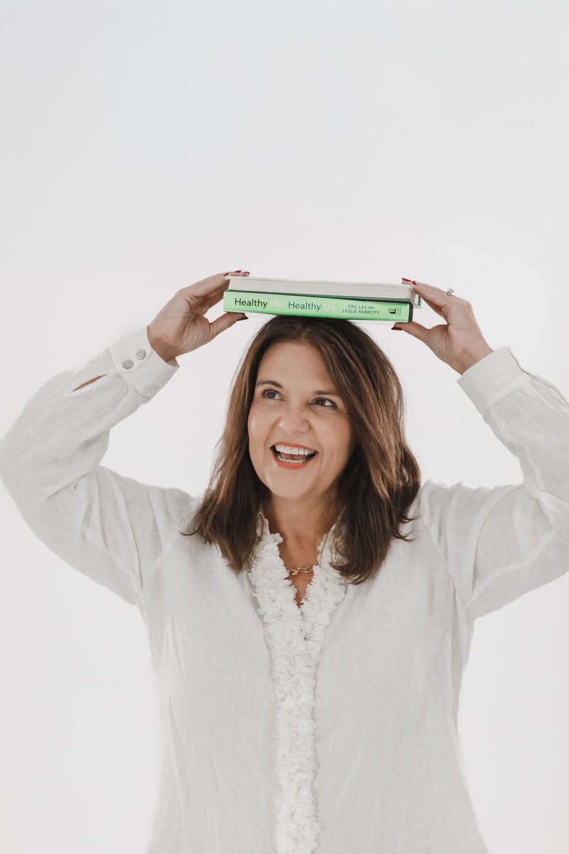 Lisa - with books - on her head-Trust Again - Healthy me, Healthy us book