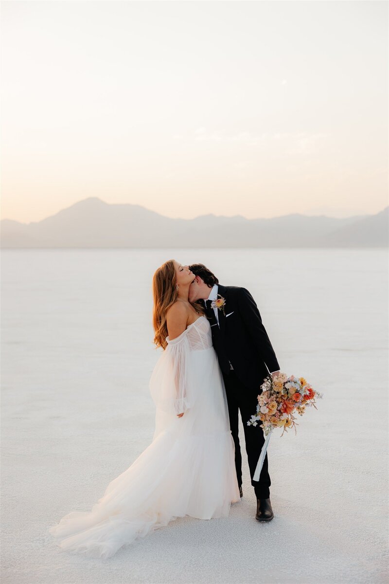 wedding couple in desert at sunset