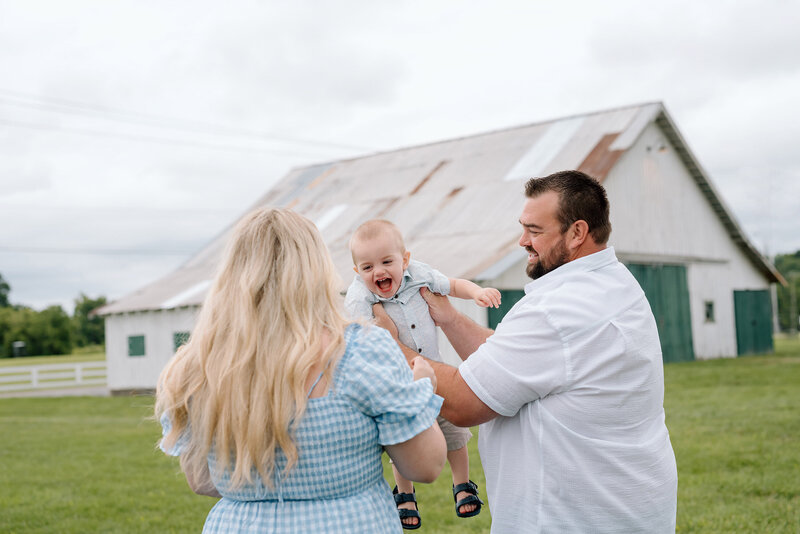 Jillian and her husband playing with their son