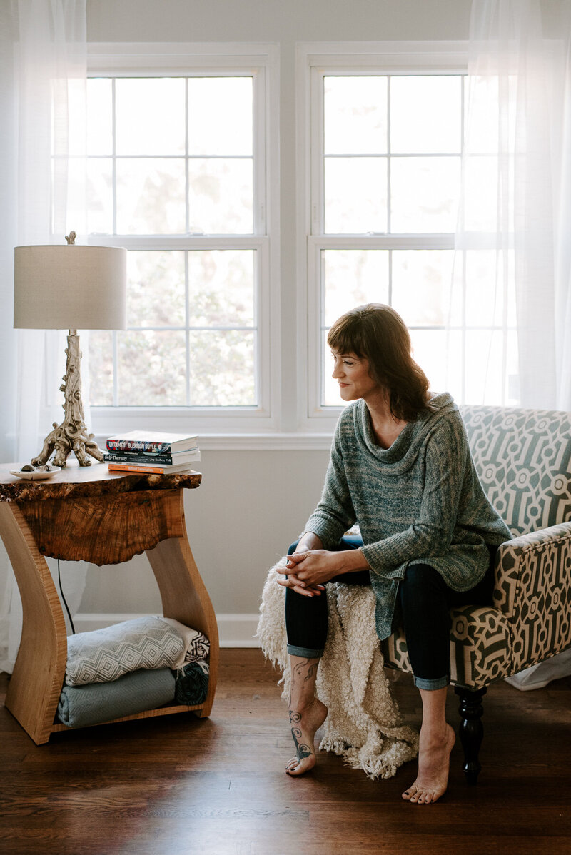 Woman sitting in her livingroom
