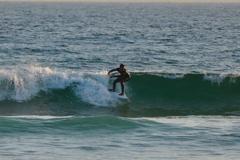 A groom surfing the day before his wedding.