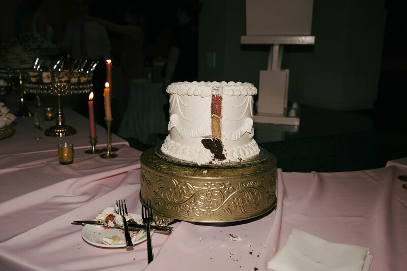 Slice missing from wedding cake Temecula wedding photographer image