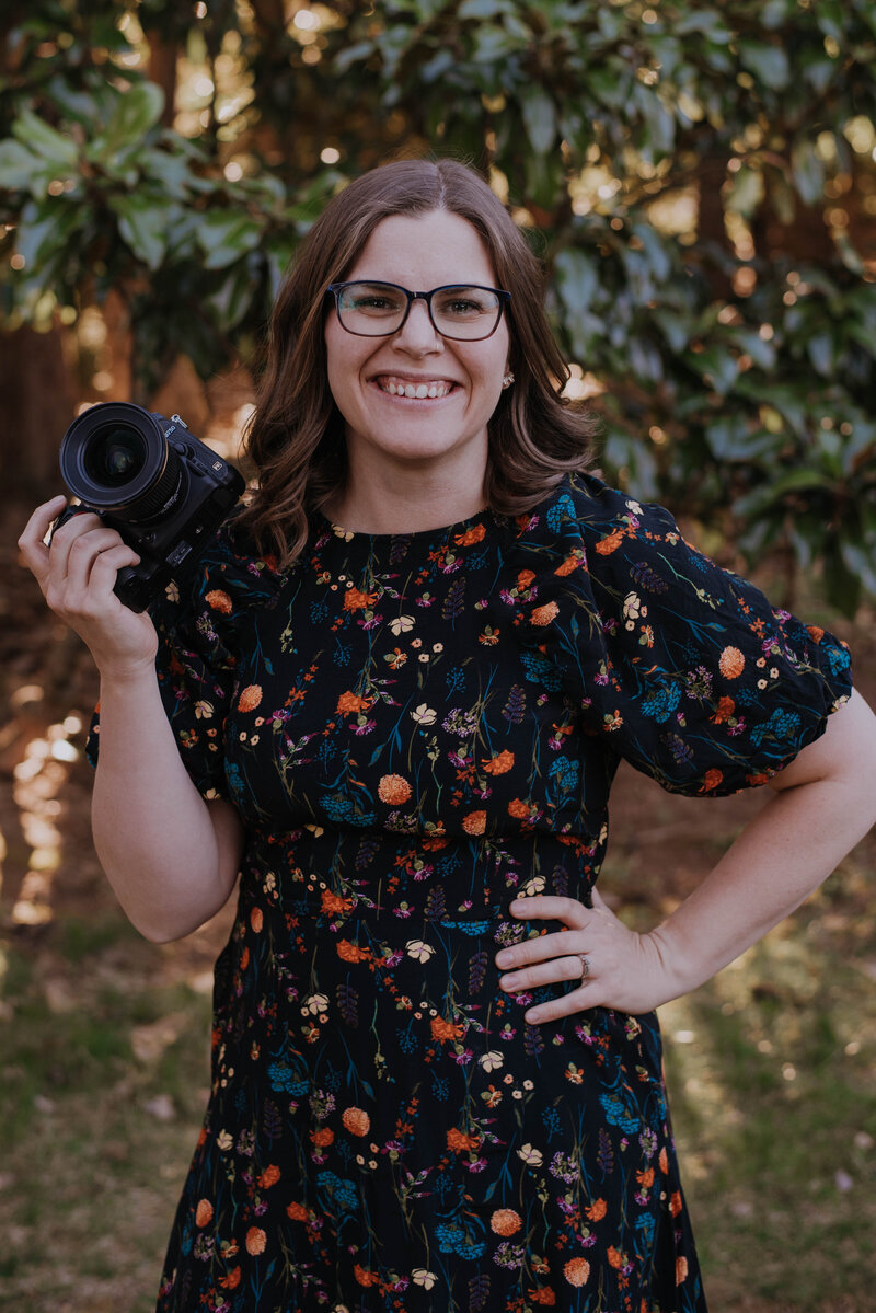 DMV area photographer Danielle Towle holding camera