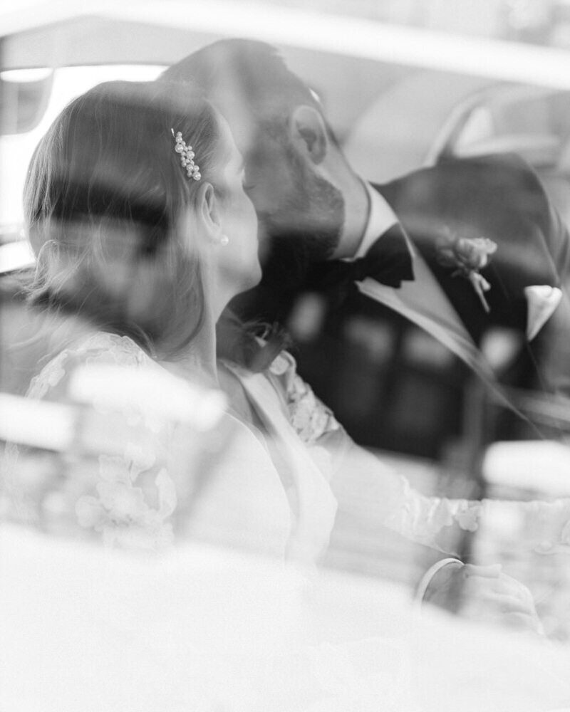 A bespoke image of a bride walking gracefully through the snow at Lake Louise. Captured on a gorgeous winter day, she holds a stunning bouquet, surrounded by the serene beauty of the snowy landscape