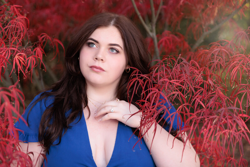 Raleigh High School Senior with fall foliage.