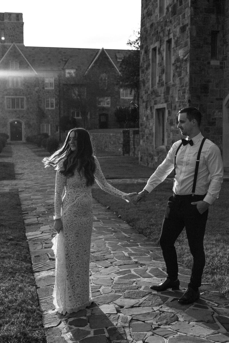 Groom gazing at his Bride as the sun illuminates her in her lace gown in North Carolina, documented by Andrea-Marie Photography