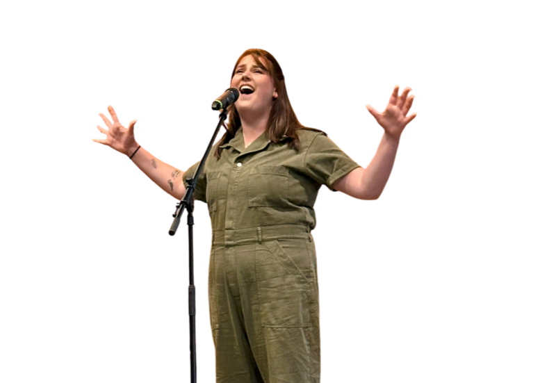 M.J. Johnson voice student singing in khaki jumpsuit