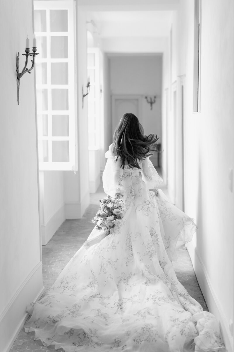Midwest wedding bride running away from camera in floral dress