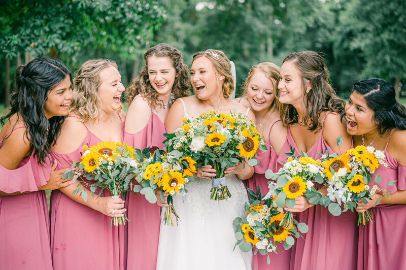 Bride with bridesmaids at the Annex Weddings and Events in Navasota, TX