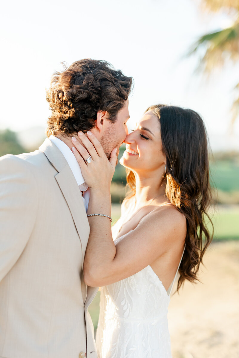 couple touching noses by wedding photographers miami