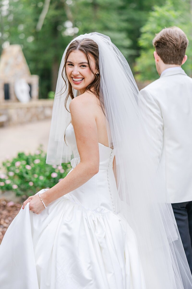 Laughing bride walking with groom by Auburn Wedding Photographer Amanda Horne