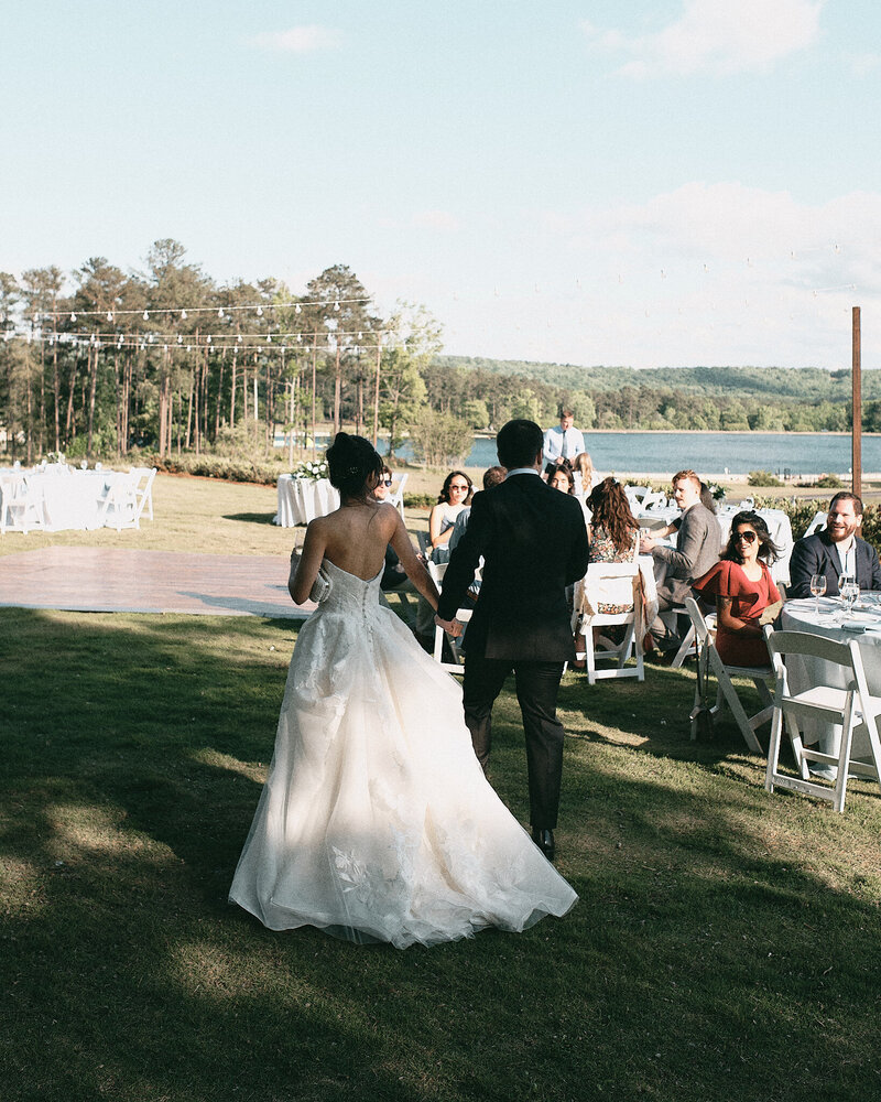 Wedding couple walking into their private reception