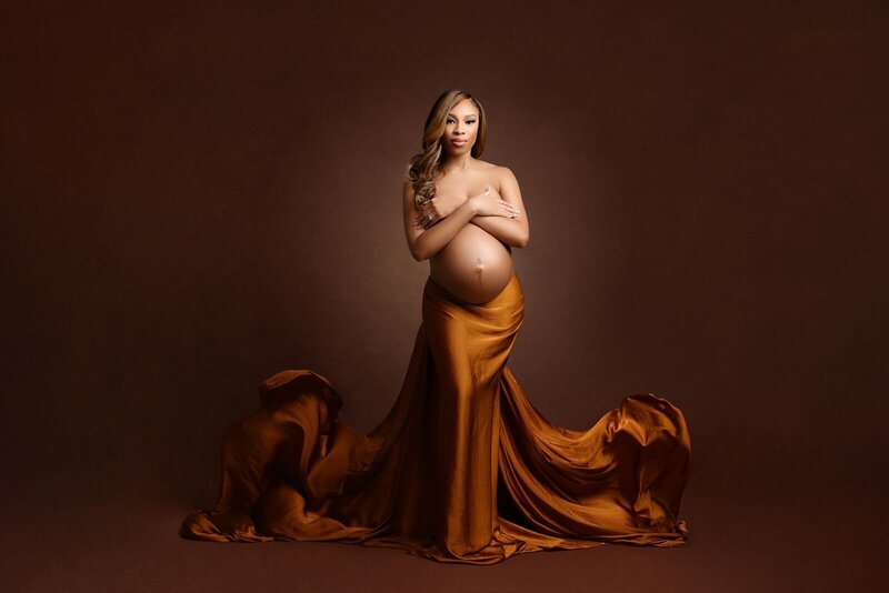 Pregnant woman in an elegant silky fabric