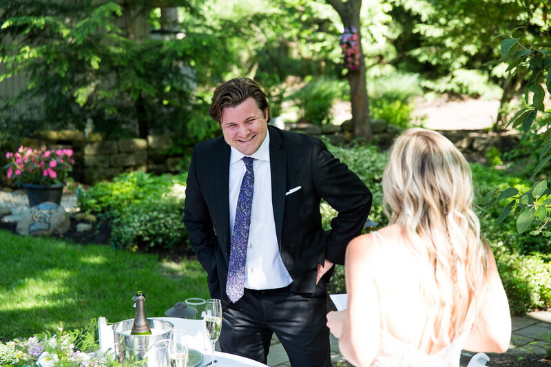 groom laughing during speech