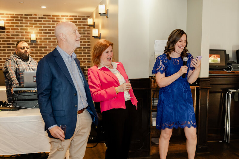 Couple laughing during a toast