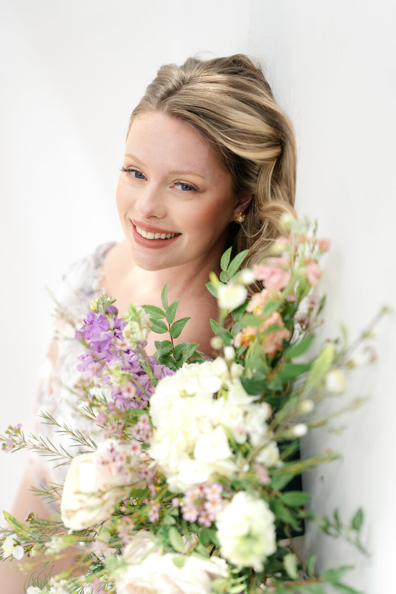 In-studio Maternity Session with floor floral arrangments for mother's day minis photoshoot