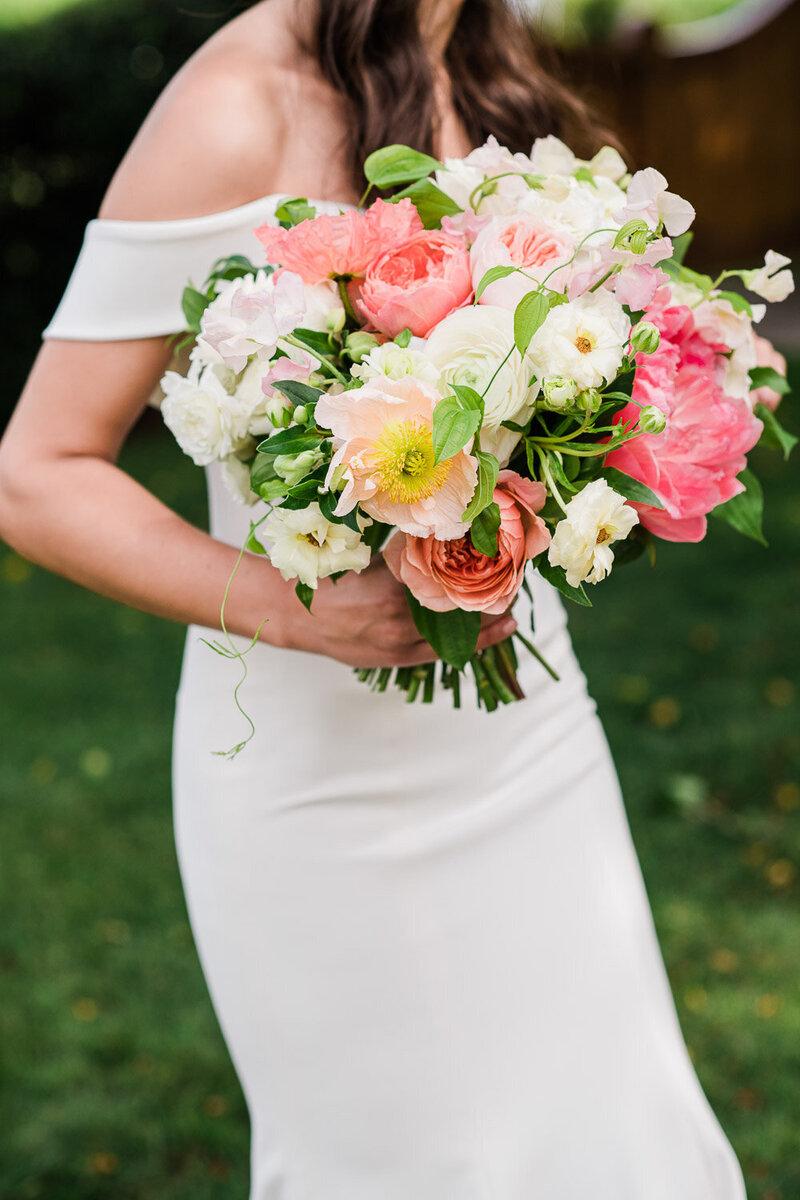 bride with vibrant bouquet