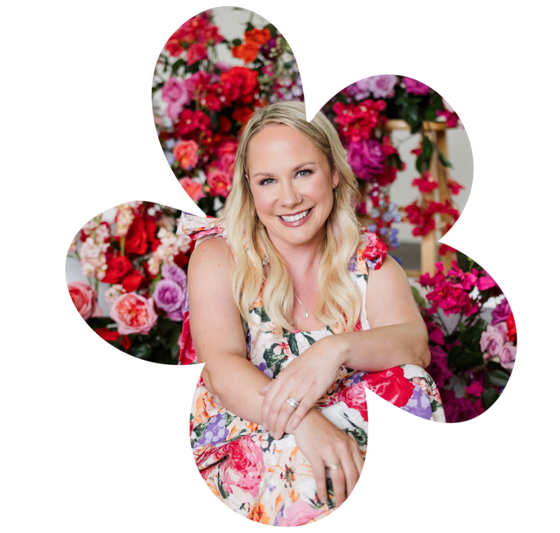 Bloom Bar founder in floral dress, framed by bold blooms, representing the heart and creativity behind Austin corporate event design.